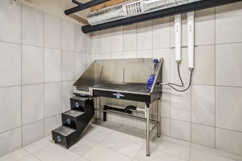 A stainless steel table in a kitchen with a sink